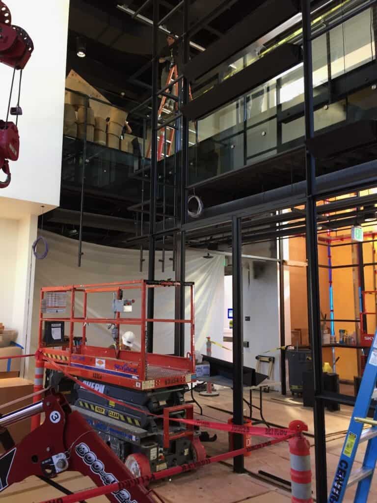 Atrium with steel and glass balustrades during construction