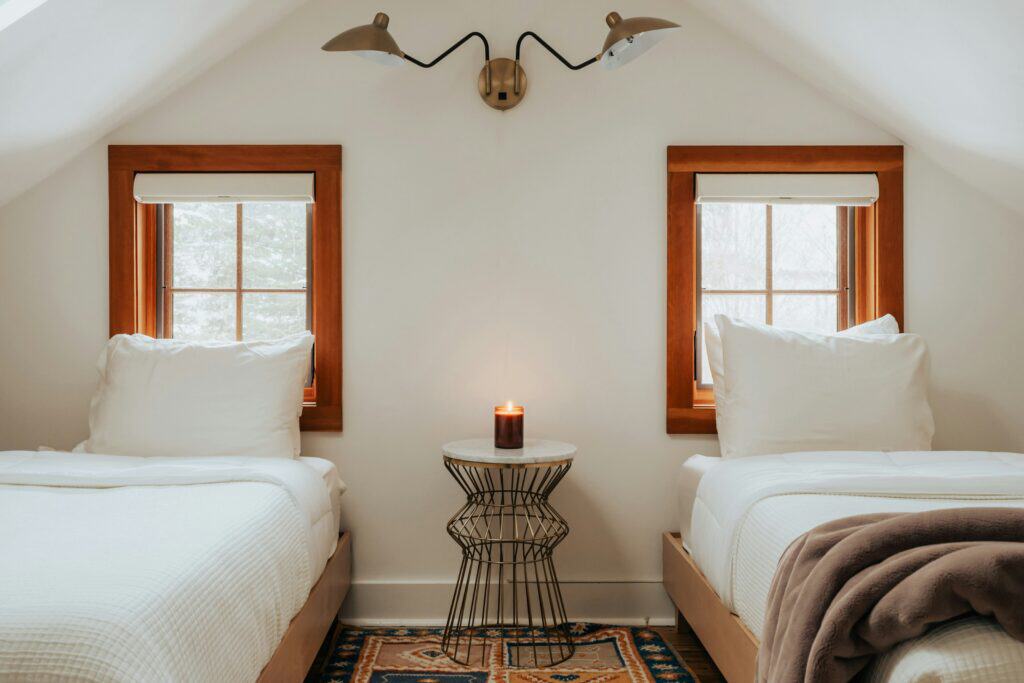 Bedroom with a pair of timber framed windows