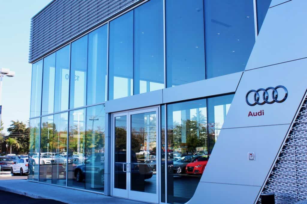 Blue tinted glazing at the entrance of an Audi dealership