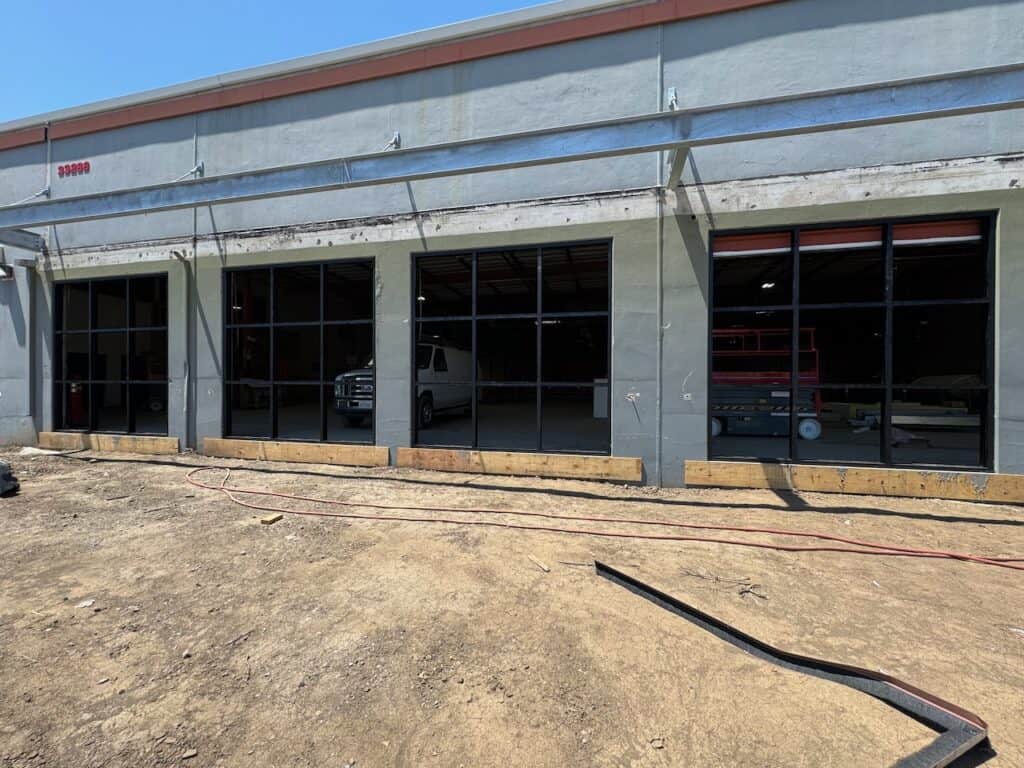 Commercial building under construction with bay openings prepared for glass