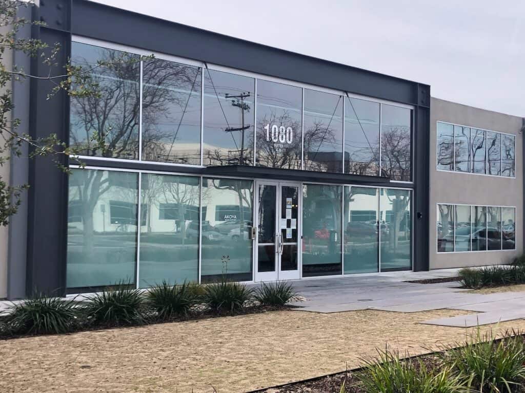 Commercial building with a glazed frontage and landscaping