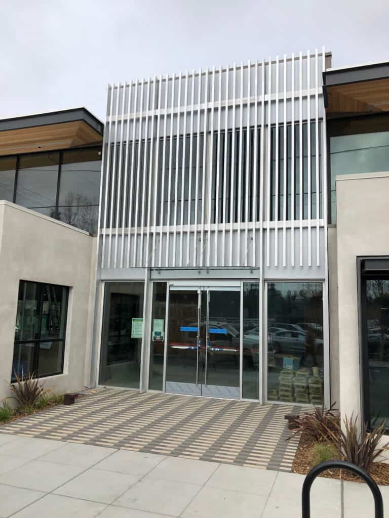 Glass entry doors installed at a commercial building entrance