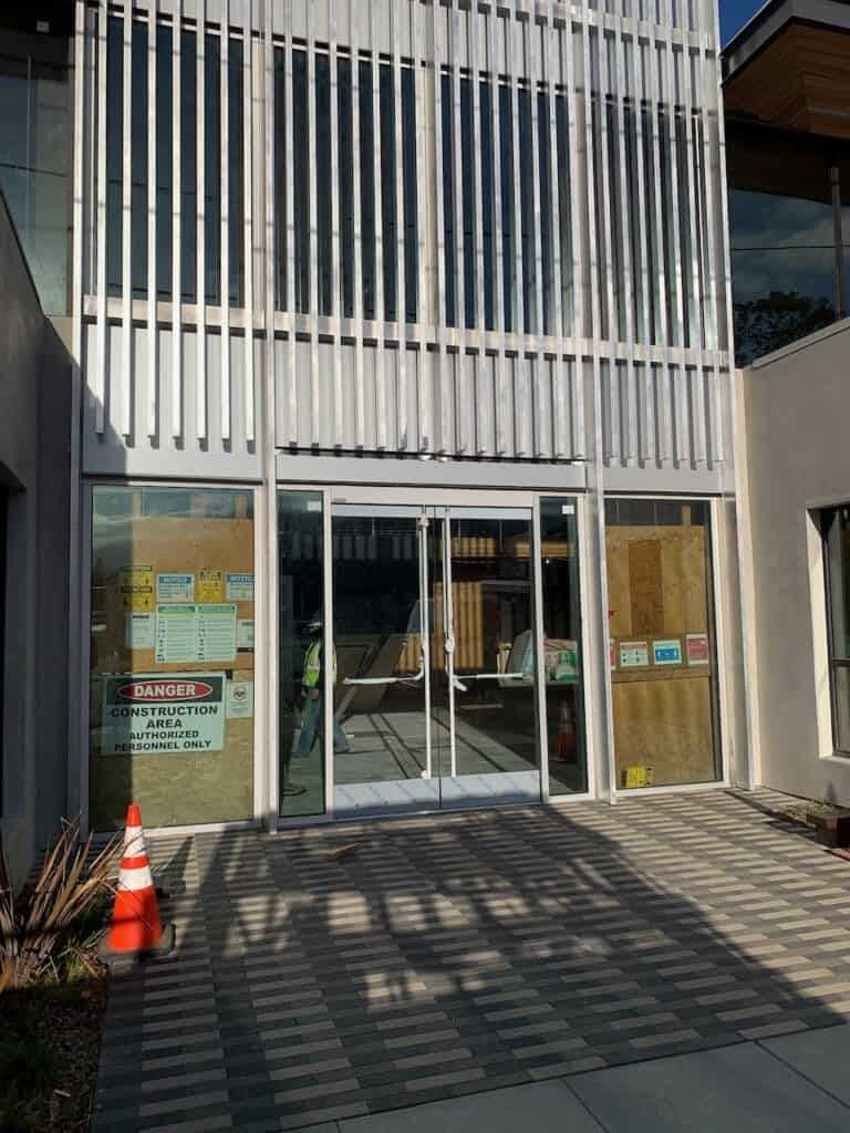 Commercial glass entry doors during a storefront fit out