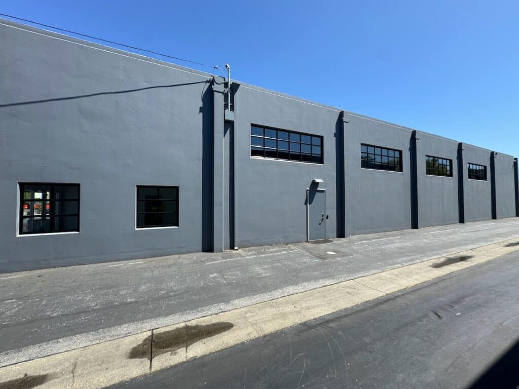 Street view of a commercial building with newly glazed windows