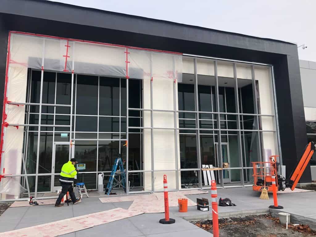 Curtain wall glazing being installed on a building exterior