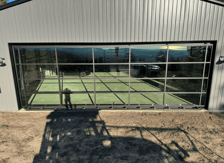 Glass garage style door fitted to a commercial building