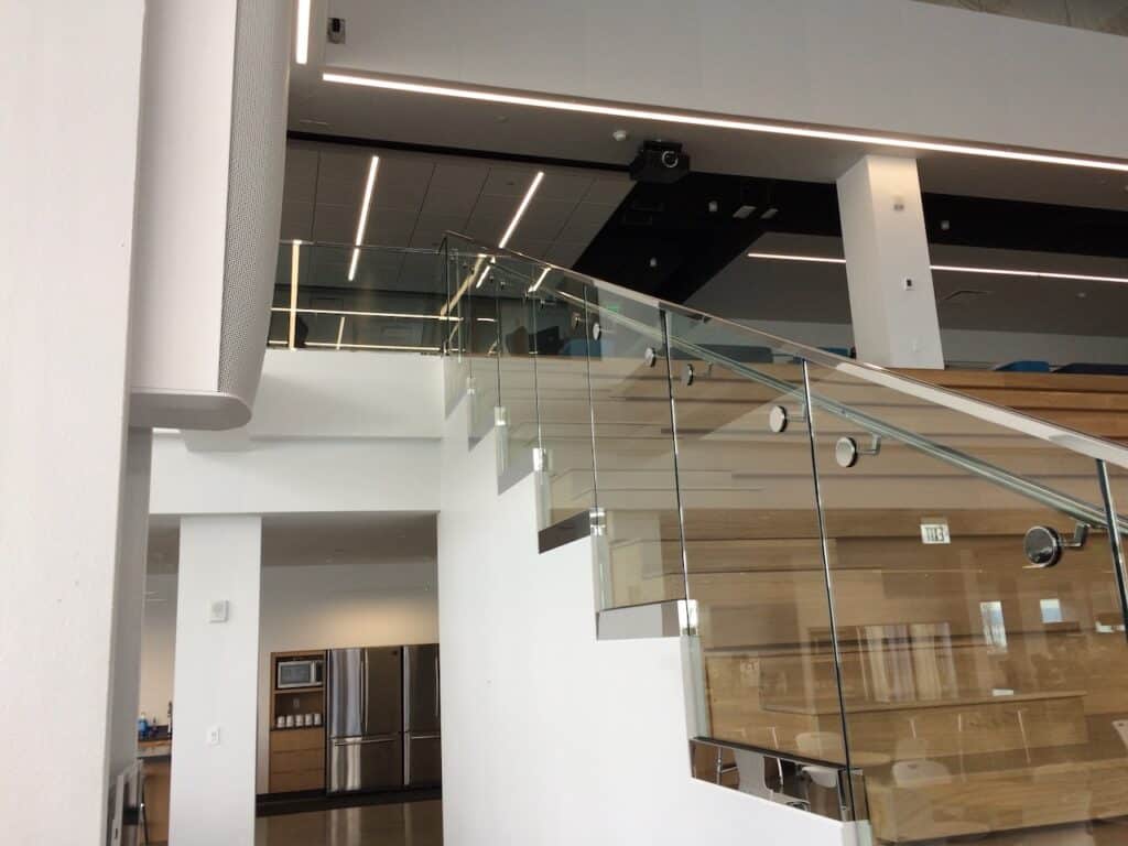 Glass railing along an upper floor walkway