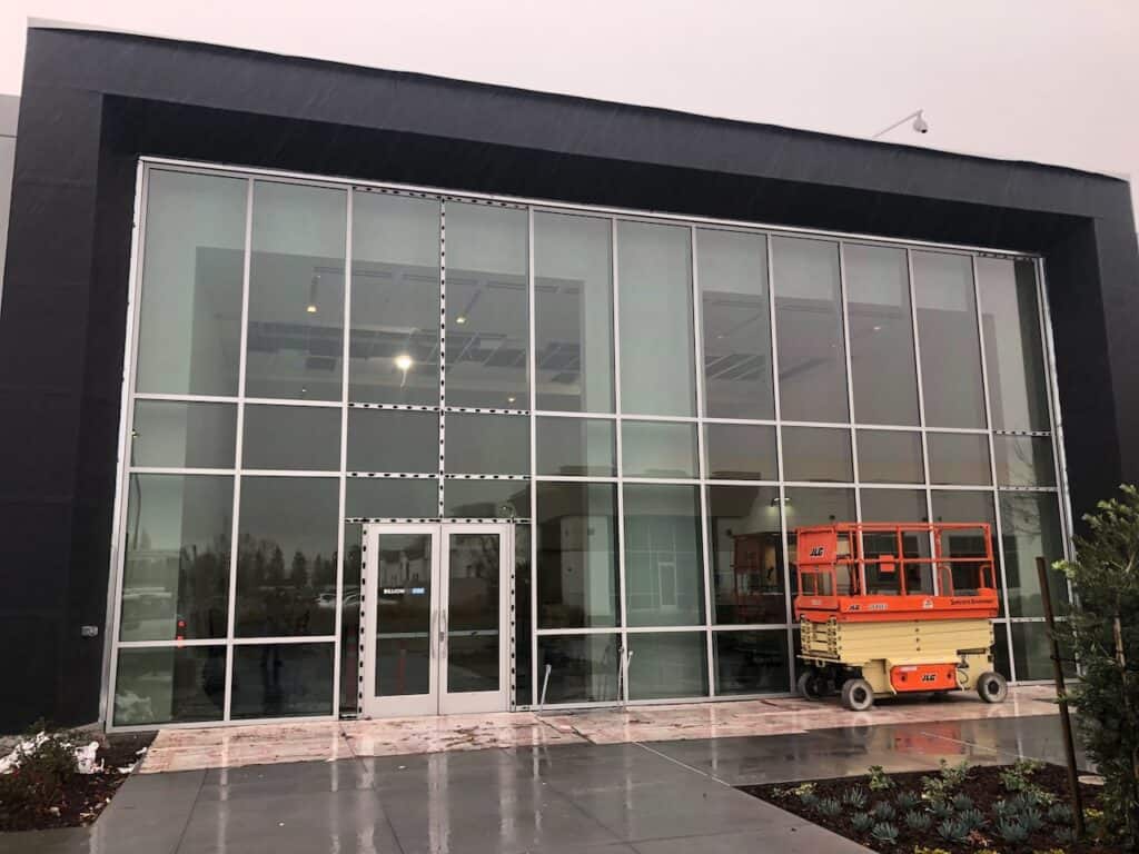 Glazed curtain wall facade with access equipment