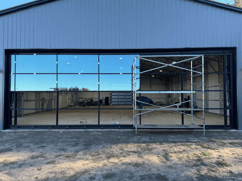 Glazed door system installed with access scaffolding in place
