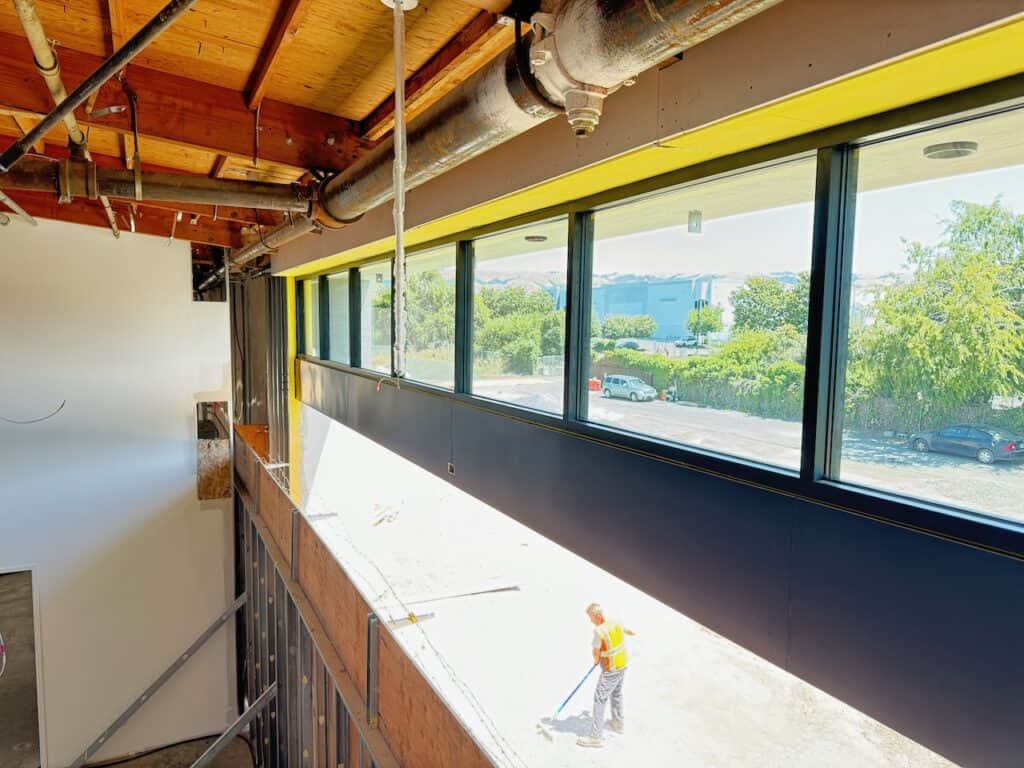 Interior of a commercial space with a newly installed band of windows