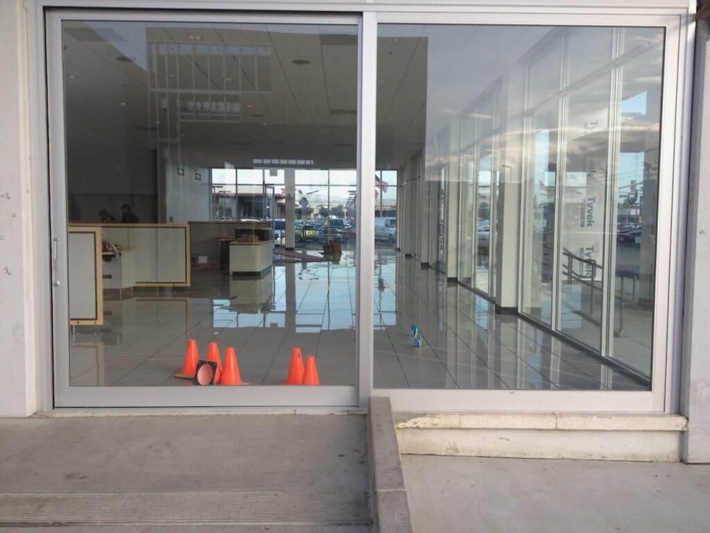 Interior of a commercial unit behind newly installed storefront glazing