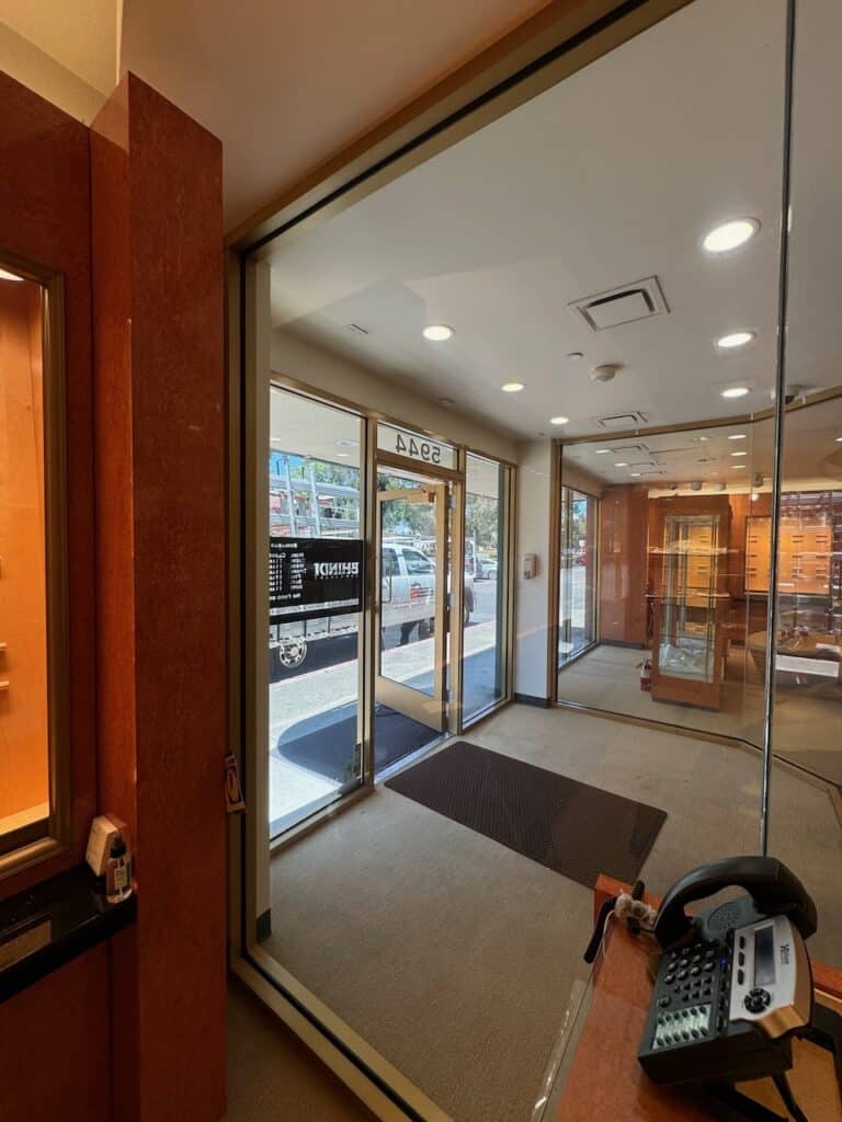 Interior entrance with timber doors and full height glass panels