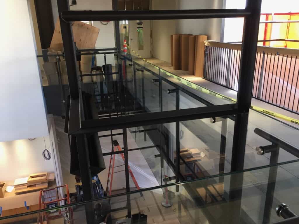 Interior stairwell with a glass balustrade under construction