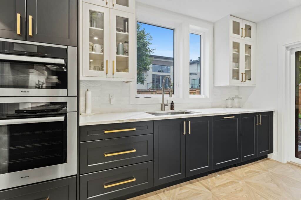 Kitchen with a window above the sink and glazed cabinet doors