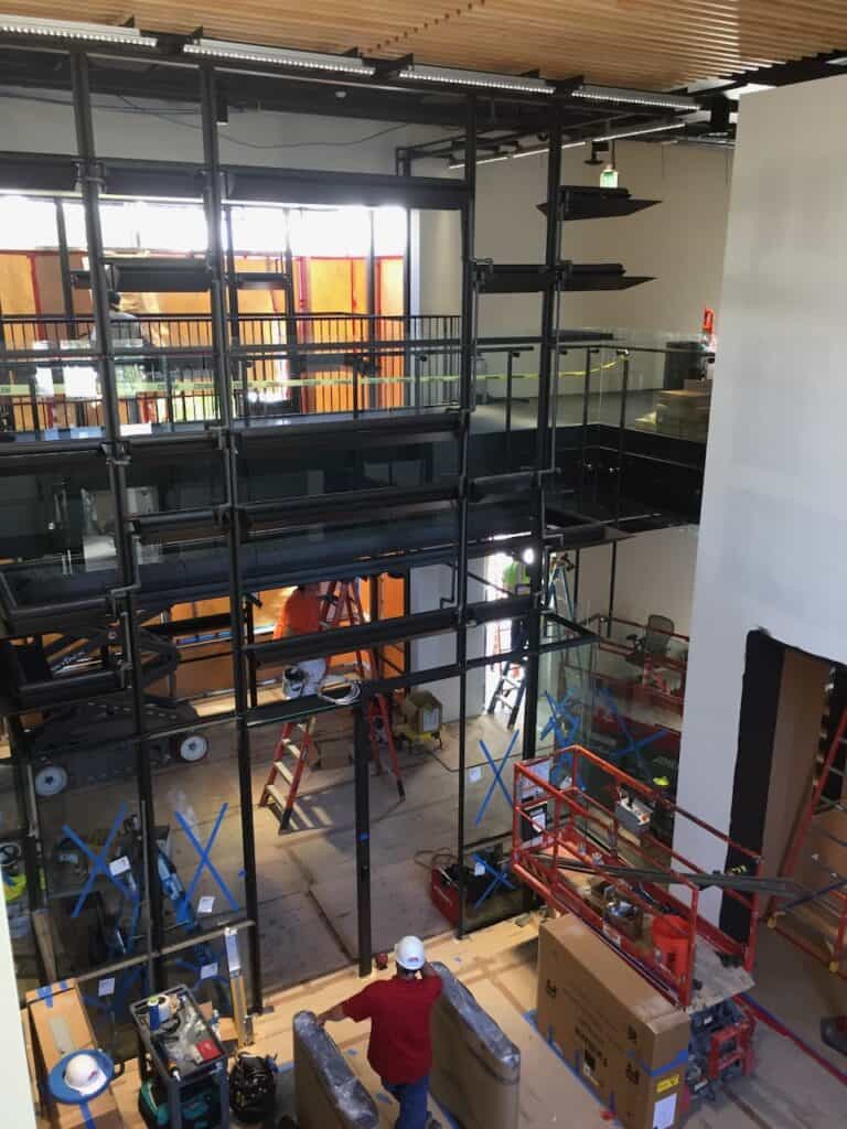 Mezzanine glass railing in a black steel frame