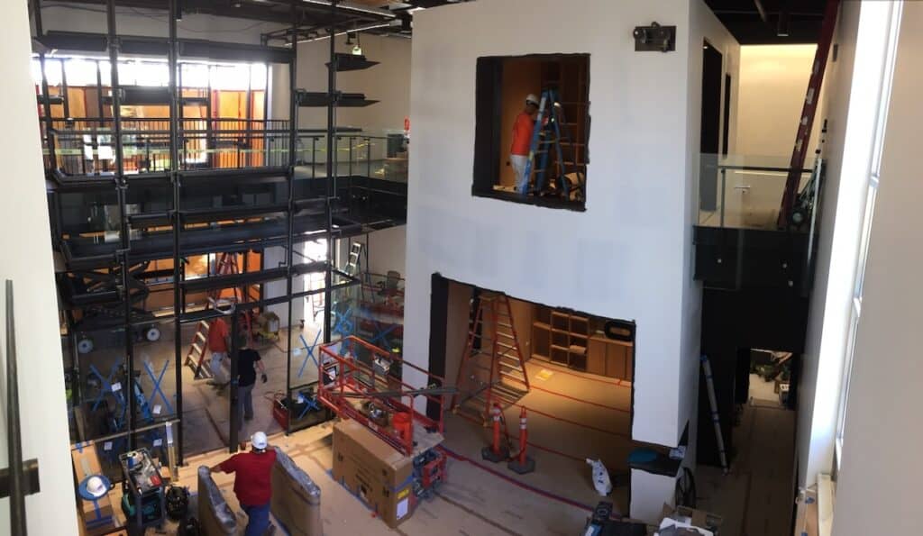 Multi level atrium with glass balustrades being installed