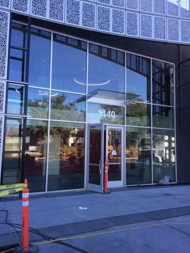 Reflective storefront glazing on a commercial unit