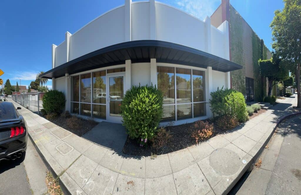 Storefront glazing along the corner of a commercial building