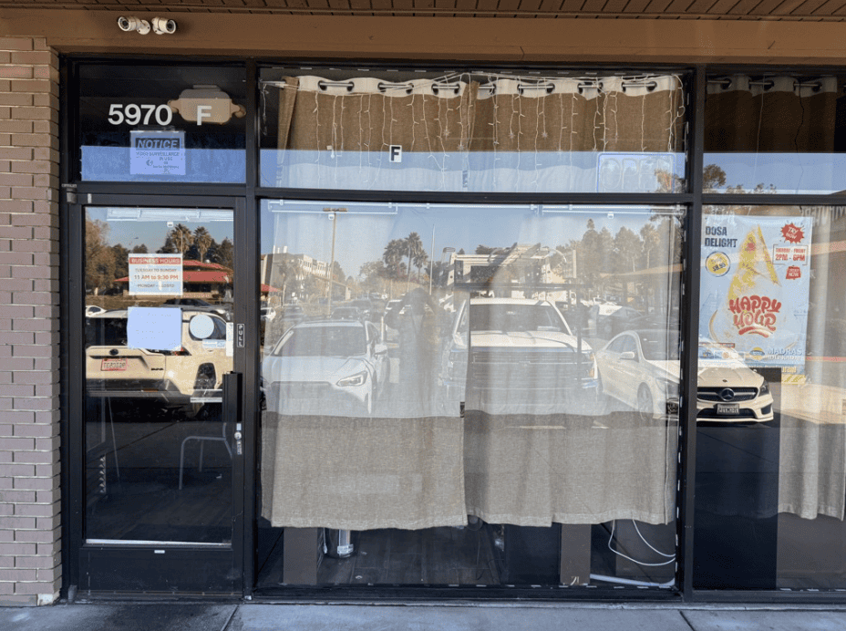 Storefront glazing covered with protective paper during works